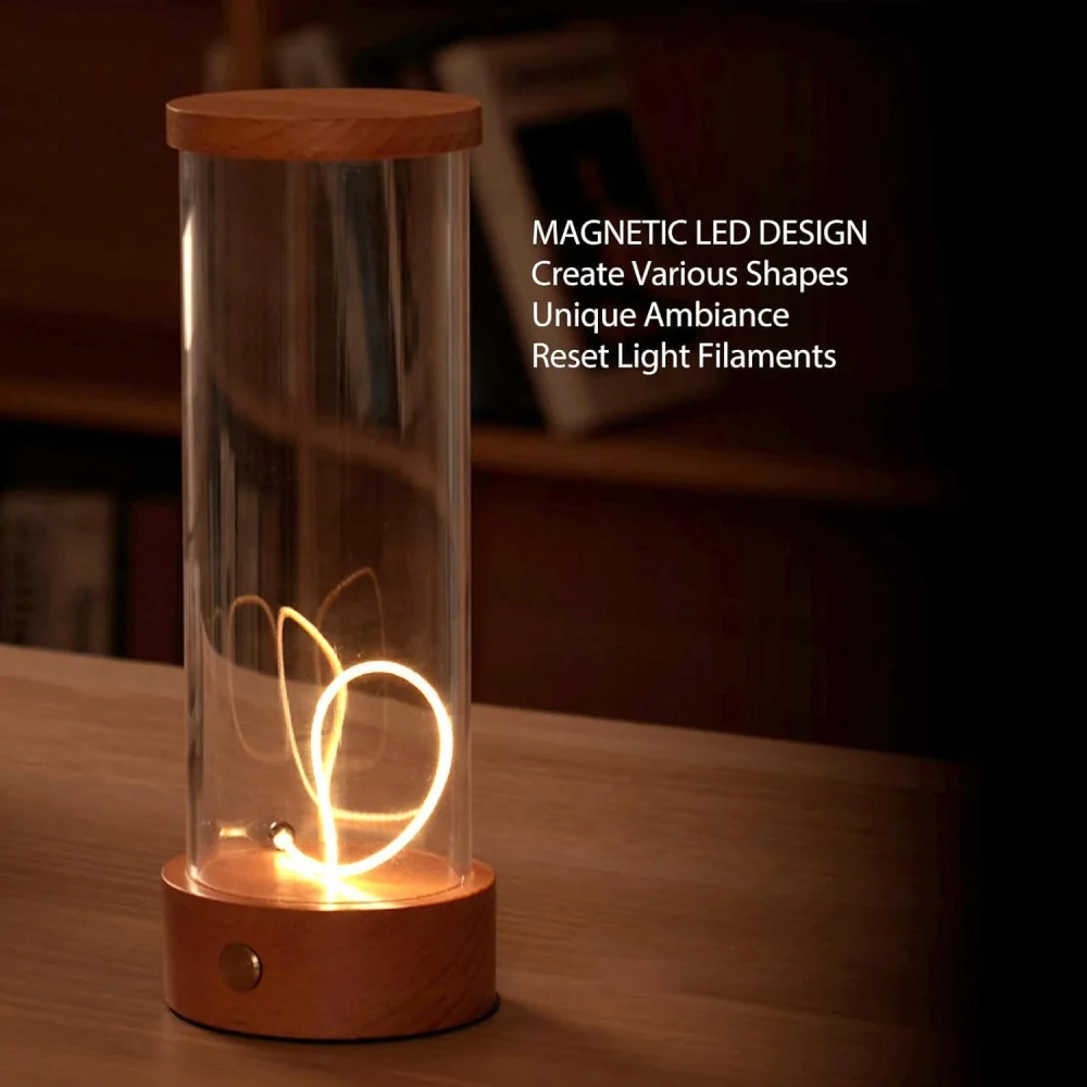 Світна нитка лампи 1492, скручена в петлю, і напис Magnetic LED Design